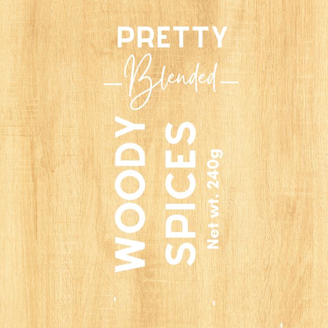 Candle label with 'Pretty Blended Woody Spices' text