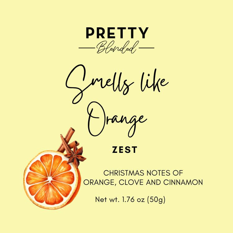 Soy wax melts label with orange slice, cinnamon stick, and text on a yellow background