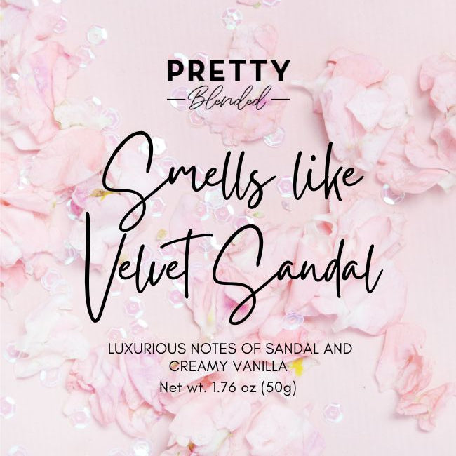 Product packaging with pink floral background and text about fragrance notes.
