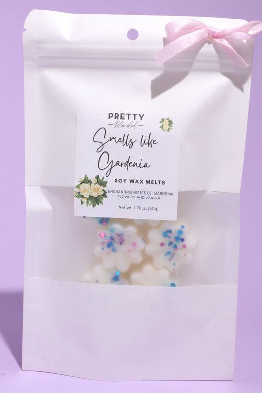 Packaged soy wax melts with decorative elements and a 'Pretty Brended' label on a purple background