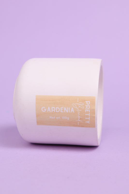 Soy Candle with a 'Gardenia' label on a purple background